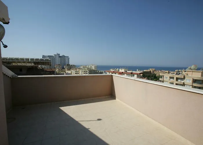 Corner terrace overlooking the sea and city in a penthouse in Tosmur for sale