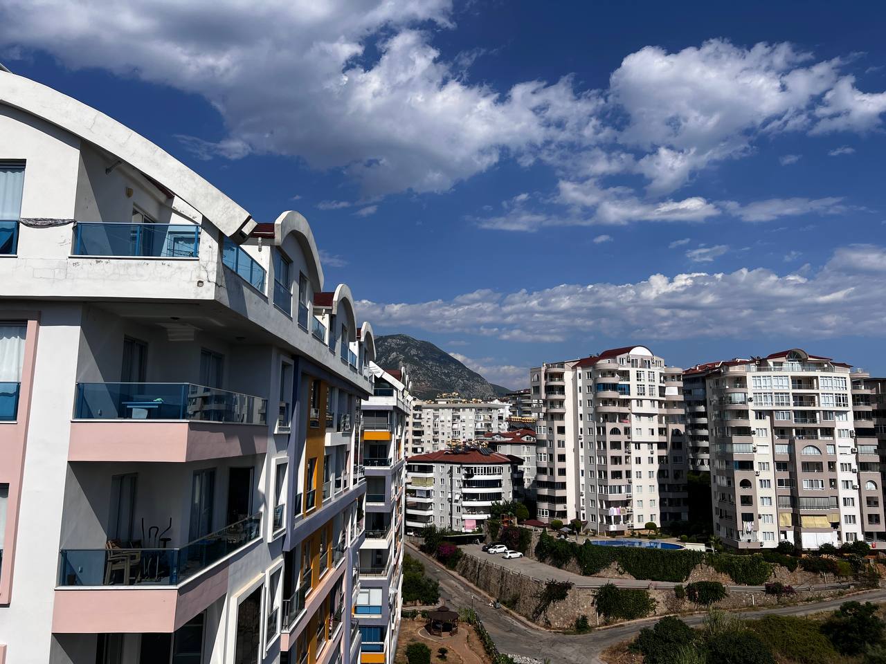 View of a residential district and mountain slope from an apartment in Tosmur